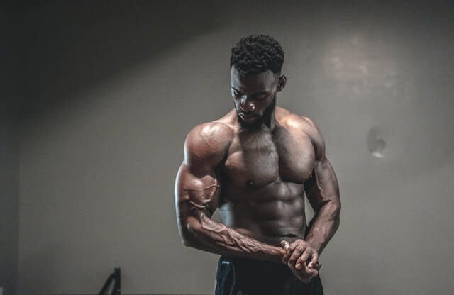 a man in the plank lifting weight